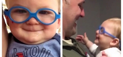 Visually disabled infant sees his father's face for the first time with new glasses!