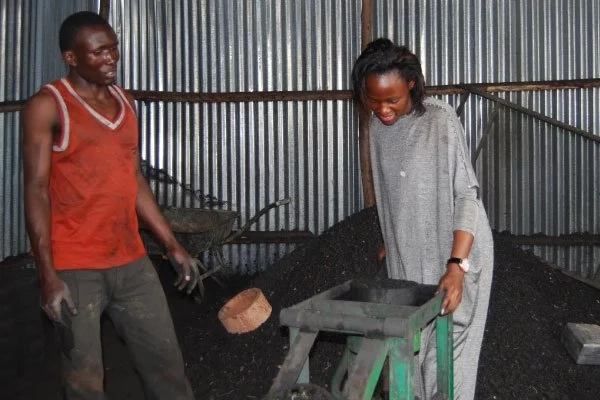 Catherine Nakitande demonstrates how to make a briquette. Photo: Daily Monitor Catherine Nakitande demonstrates how to make a briquette. Photo: Daily Monitor