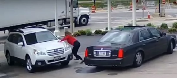 Woman stops car thief from driving away with her vehicle. She jumped on the hood unwilling to let go of her car... Woman stops car thief from driving away with her vehicle. She jumped on the hood unwilling to let go of her car...