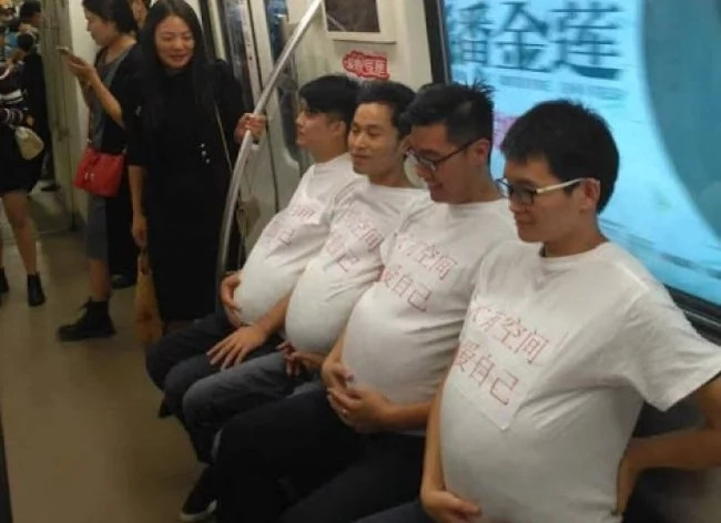 Are these men pregnant? No, they just support their wives! Are these men pregnant? No, they just support their wives!