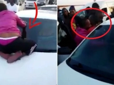 Man was caught cheating. Wife clings to husband's car windscreen as he escapes with 'side chick'