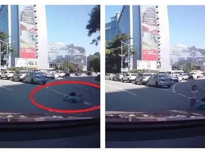 Their mom was driving the car. Moments later, two children fall out of their car boot and she does not seem to notice