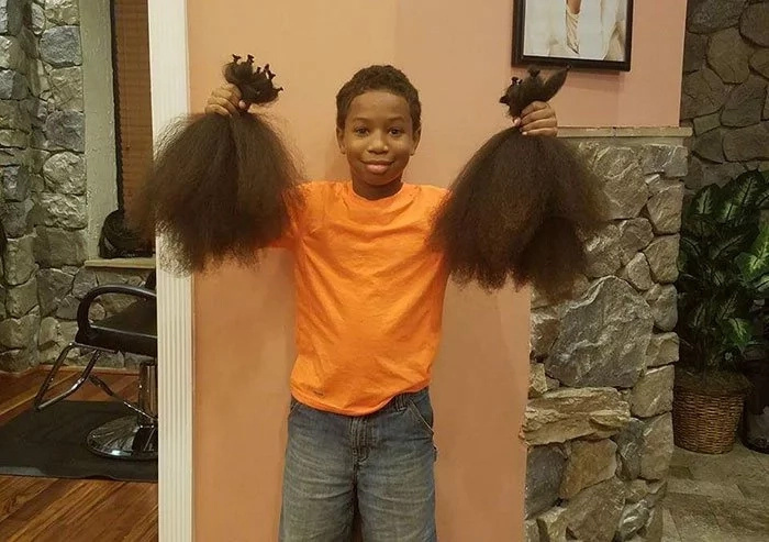 This young boy grew out his hair for young kids diagnosed with cancer! This young boy grew out his hair for young kids diagnosed with cancer!