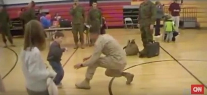 A boy with cerebral palsy walks to his Marine dad for the first time after not seeing him in over a year!