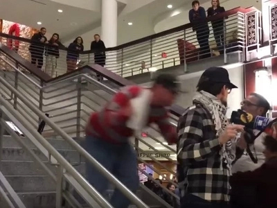 Anti-Trump Protestor Is Shoved Down Stairs By Autistic Patriot