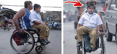 Wheelchair-bound father takes son to school in his wheelchair every day, earns praises and sympathy from netizens