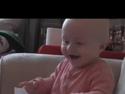 This baby, laughing hysterically at ripping paper, will make your day!