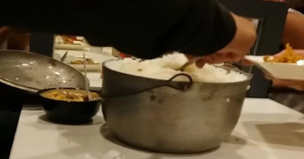 Boy enjoys extra rice at KFC by bringing own rice pot Boy enjoys extra rice at KFC by bringing own rice pot