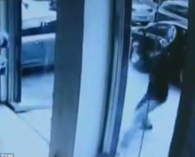 Shocking moment an angry man leads a club-wielding gang to smash a laundry shop after 'they destroyed his favourite cardigan' Shocking moment an angry man leads a club-wielding gang to smash a laundry shop after 'they destroyed his favourite cardigan'