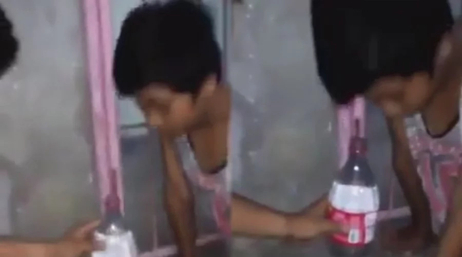 Young boy was pranked into looking through a bottle Young boy was pranked into looking through a bottle