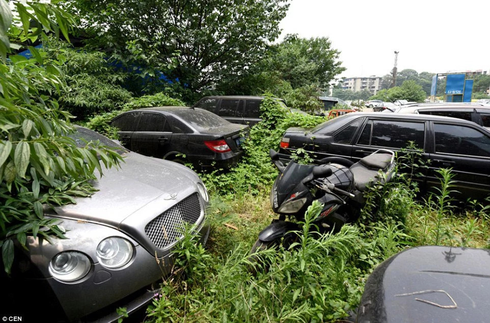 Luxury cars being dumped in a car park in China
