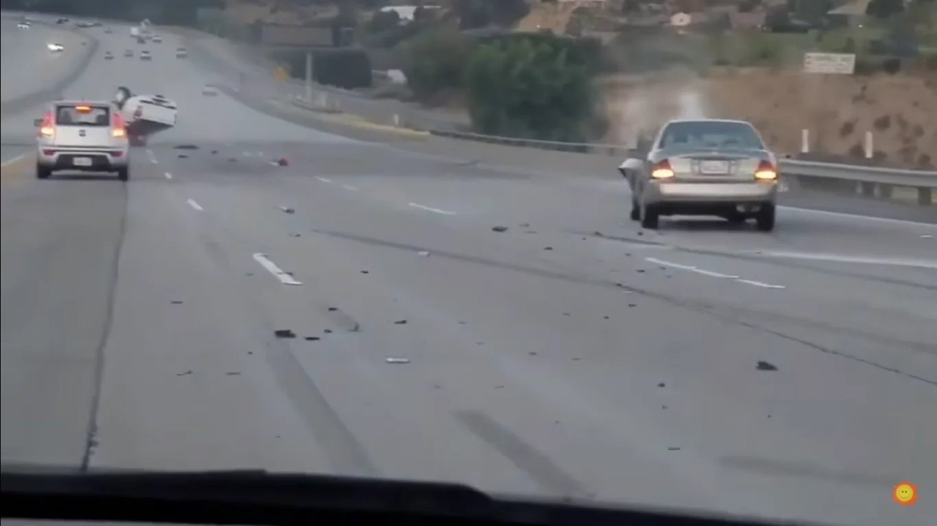 This raged biker kicked a car - which then swooped left for revenge, but it horribly goes wrong This raged biker kicked a car - which then swooped left for revenge, but it horribly goes wrong