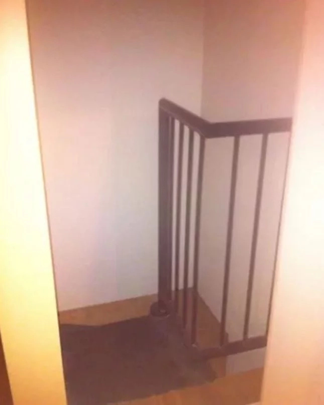 A bookshelf concealed a secret entrance to a hidden staircase A bookshelf concealed a secret entrance to a hidden staircase