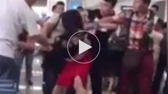 WATCH: Wife beats husband’s mistress when she catches them at the airport