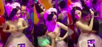 Pretentious bride lets men shove their faces on her boobs to raise money for honeymoon