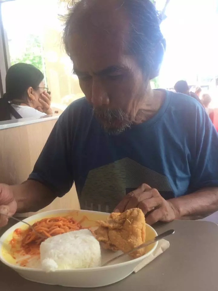 Student gives food to old man who speaks good English Student gives food to old man who speaks good English