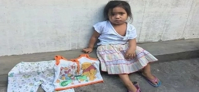 Lost child cries as she roams the streets of Quezon City in her quest for home