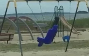 WATCH: Dad films creepy video of a ghost playing on the swing