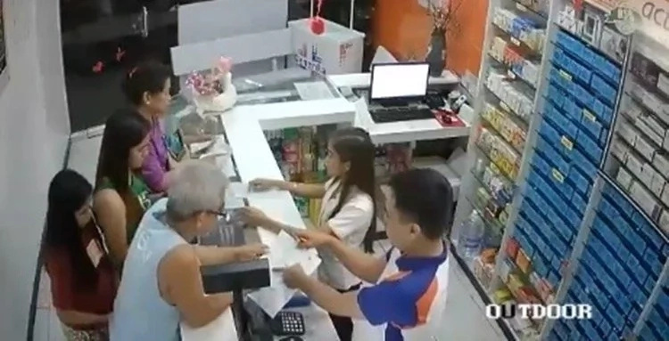 Two ladies steal wallet of old man buying medicine at drug store Two ladies steal wallet of old man buying medicine at drug store