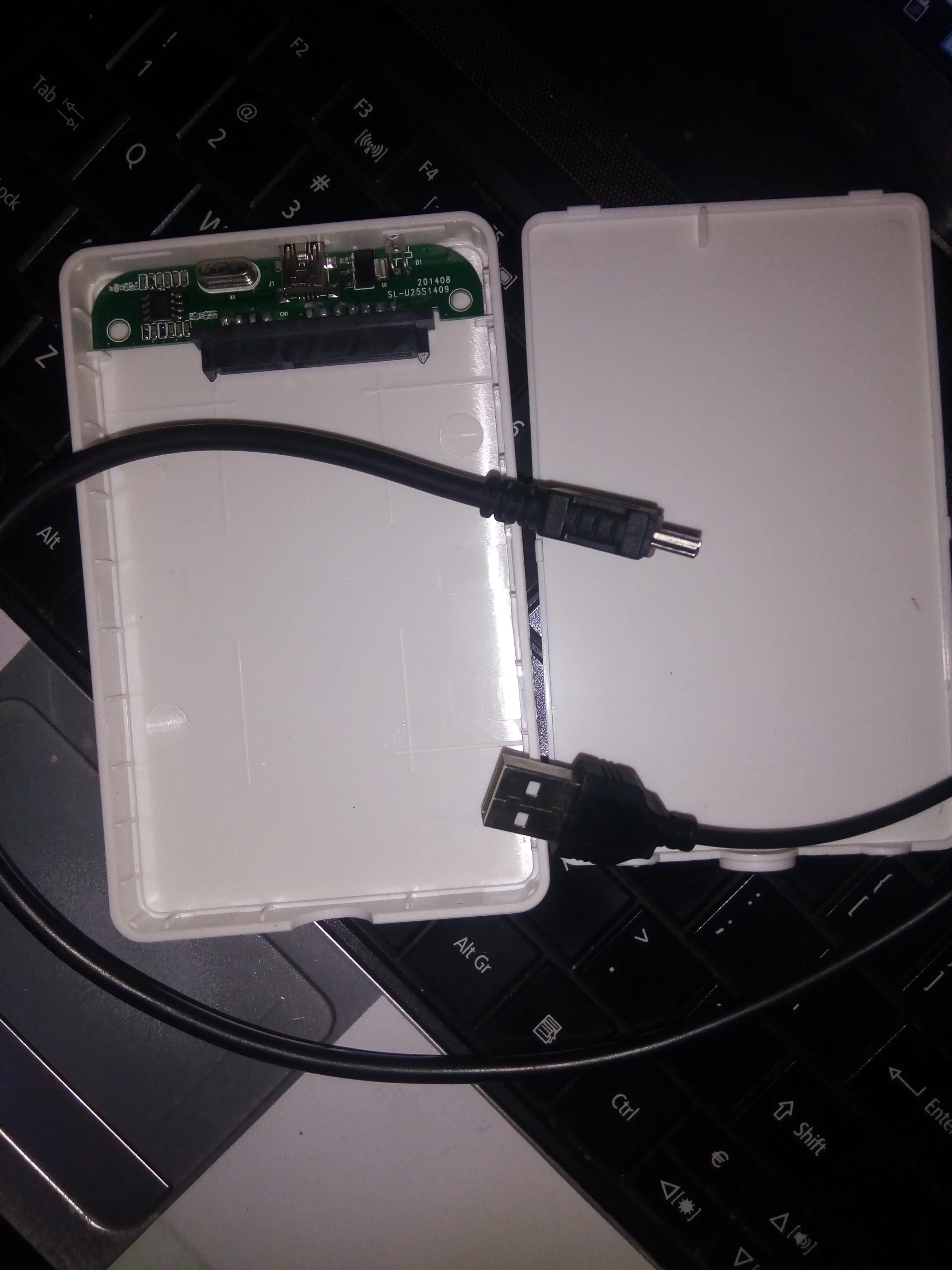 Empty hard drive enclosure helps you get files off a dead ...