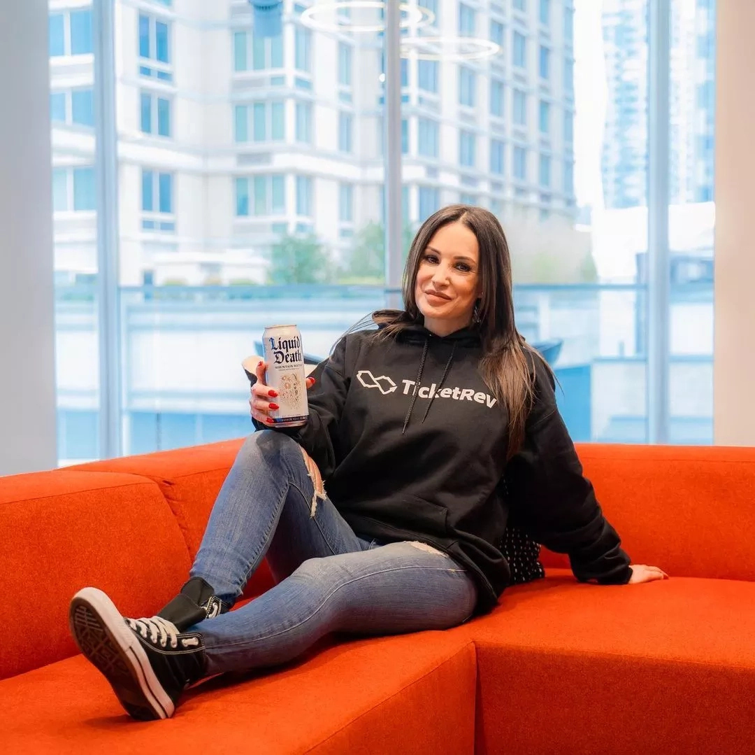 Lisa Ann sitting on the couch