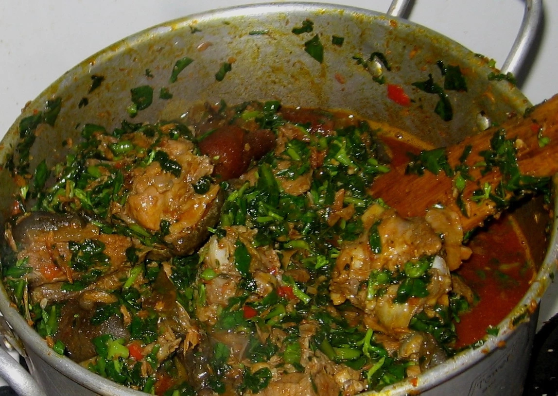 The Preparation Of Edikang Ikong Soup With Goat Meat And Oha Leaves